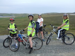 <b>The youngest cyclists on the 24-mile route stop for a well-earned break on the East Yell road. From left: Luke Aquilina, Shayne Thomson, Caroline Simpson and Calum Lindsay. </b><i>Photo: Bob Kerr</i>