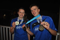 All smiles from gold medal-winning swimmers Andrea Strachan and Felix Gifford on Monday night.