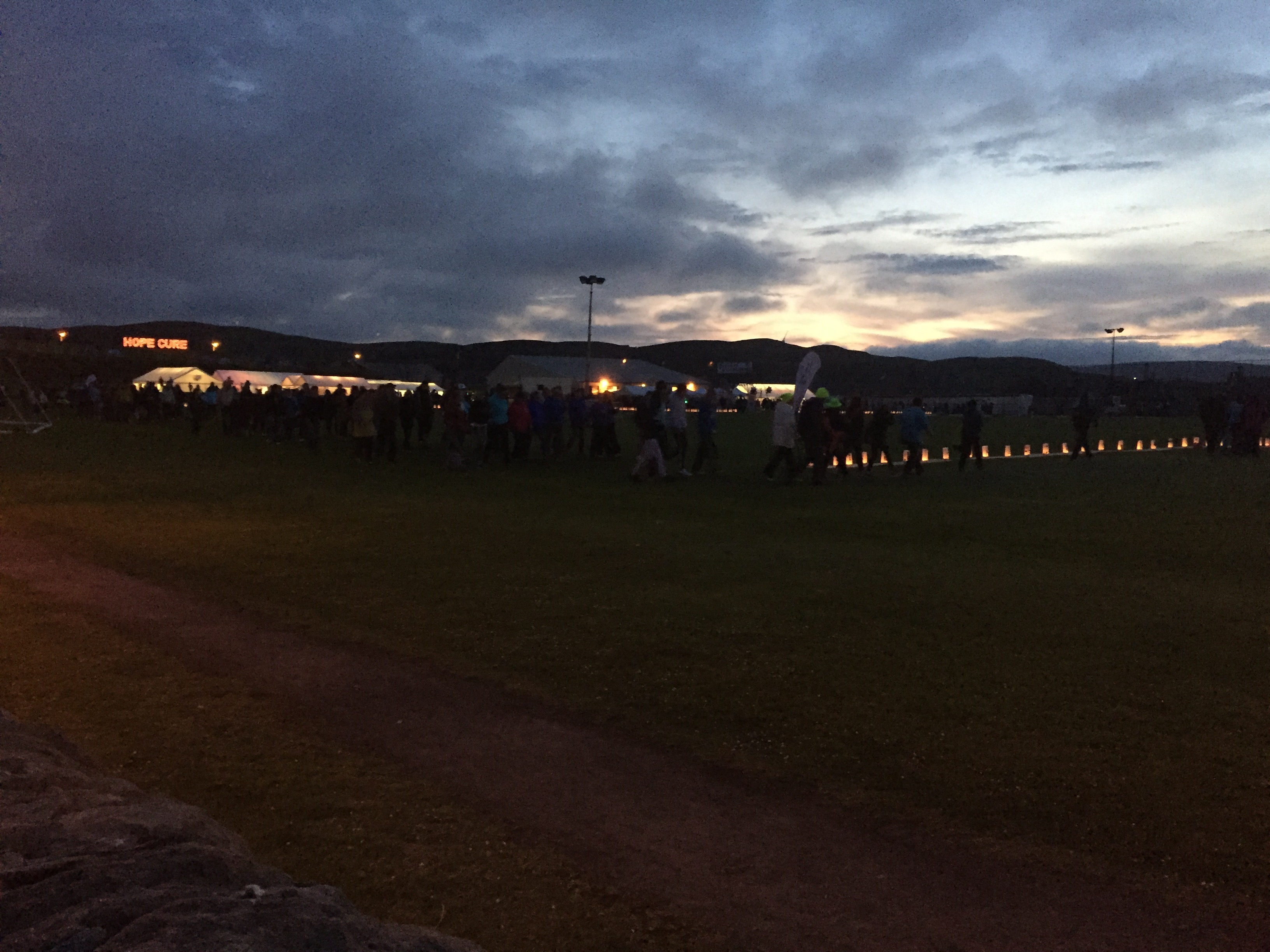'Hope' and 'Cure' illuminated on the hillside as walkers carry on through the night.